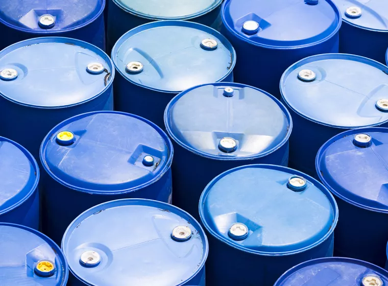 Chemicals in blue drum barrels. Exponent test and chemicals to help develop prevent fire hazards.