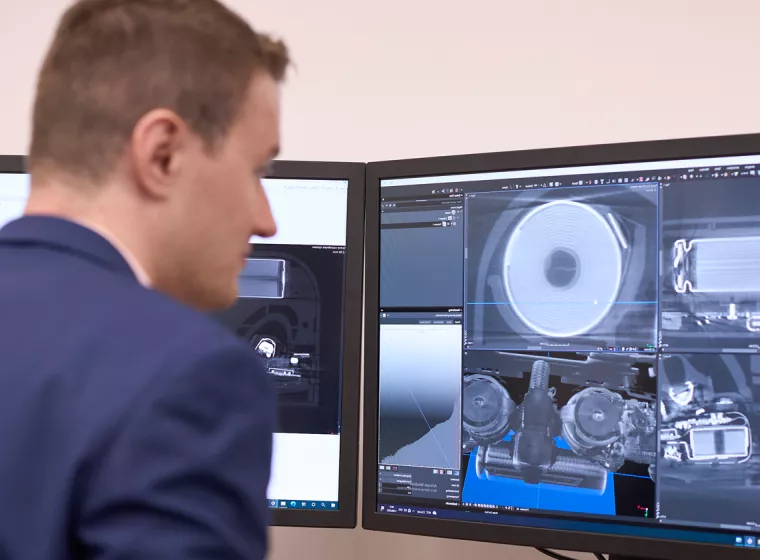 A person reviews the detailed images of batteries on a computer screen. Exponent conducts detailed battery analysis for safety and performance. 