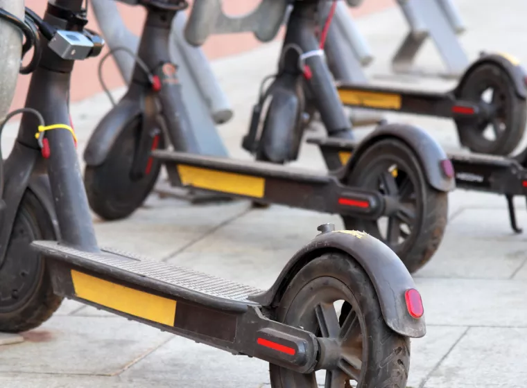 A row of battery powered scooters.  Exponent provides electrical engineering support for consumer products.