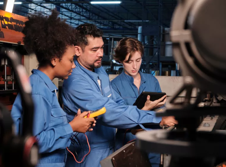 Workers Testing Machine