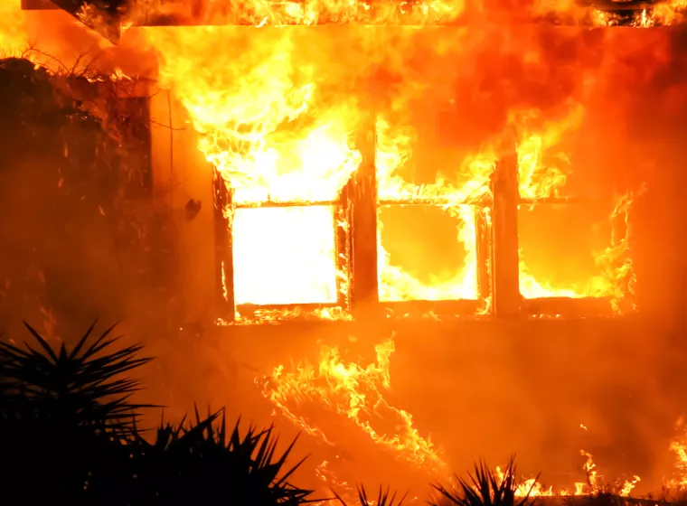 House engulfed in fire. Exponent provides fire and explosion investigations.