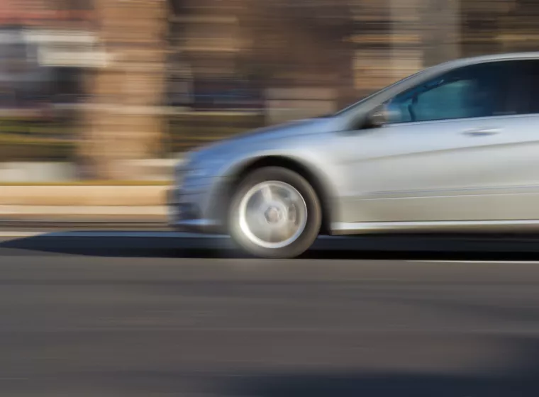 car accelerating down a road