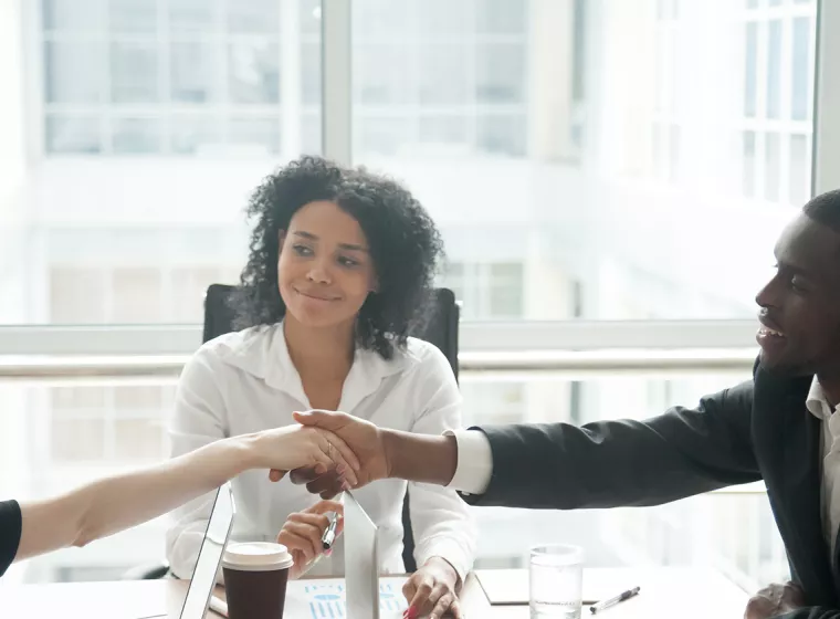 Business meeting and handshakes. Engineering support for international arbitration and construction disputes.