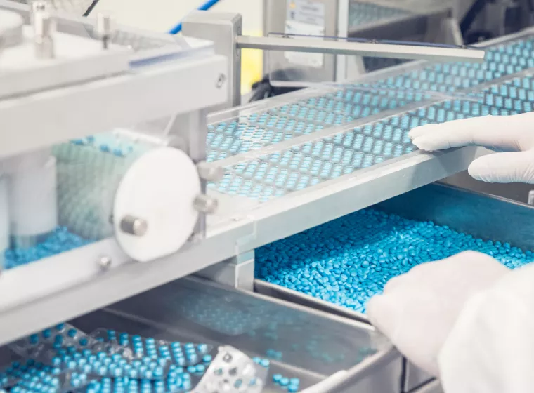 A container of pharmaceutical tablets. Exponent helps you maximize safe use conditions for pharmaceutical and biological products.
