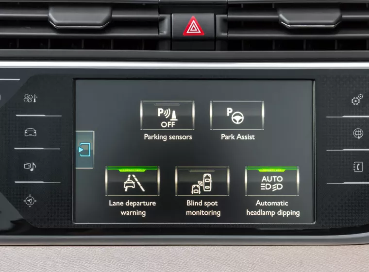 Advanced driver assistance systems buttons on the interface of a vehicle dashboard