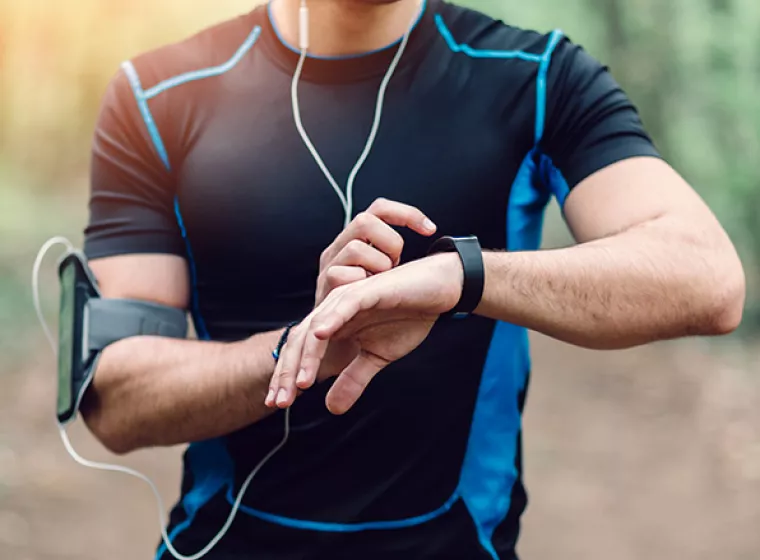 Runner checks his stats on a smartwatch. Exponent leads innovation with research, testing and evaluation of wearable technologies. 