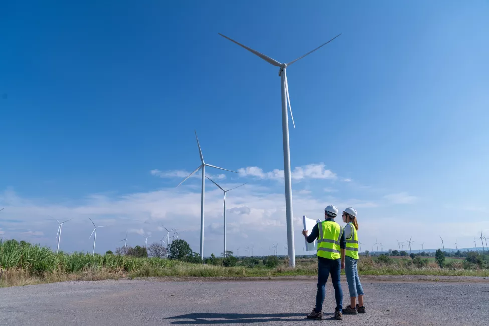 Engineers checking windmills