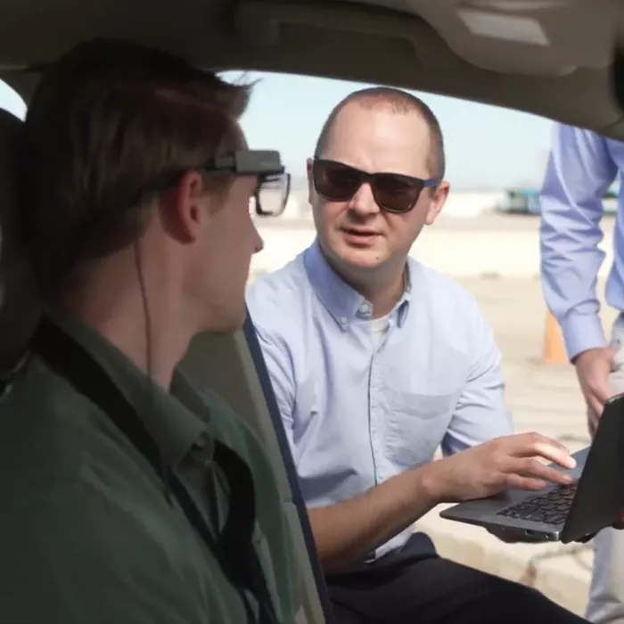 A man consults with an automotive tester