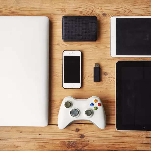 High angle shot of wireless technology on a wooden table