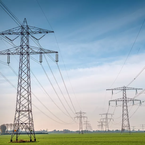 Large powerlines in a rural farm setting. Exponent helps stakeholders explore safer, more efficient and alternative energy solutions. 