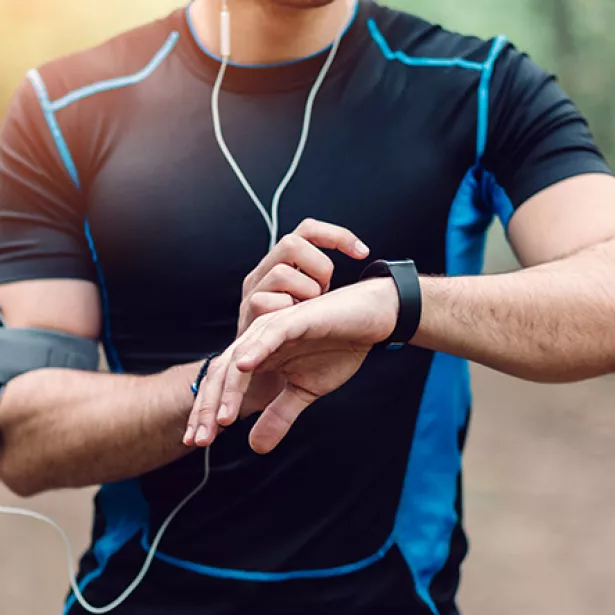 Runner checks his stats on a smartwatch. Exponent leads innovation with research, testing and evaluation of wearable technologies. 