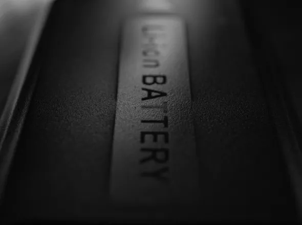 Close-up, black and white view of Li-ion battery labelled "Li-ion BATTERY"