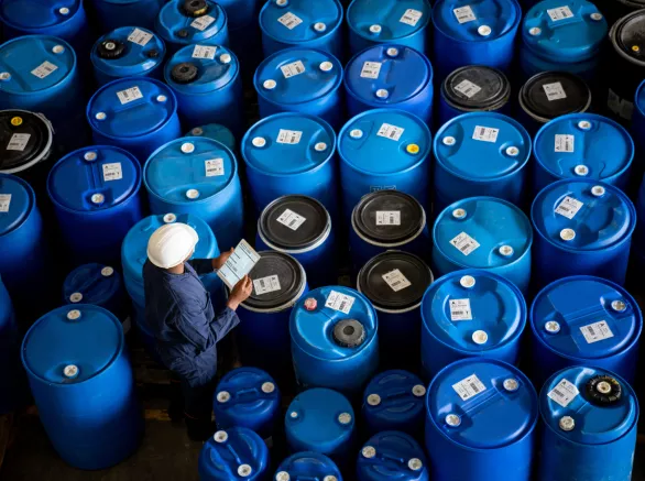 Worker does inventory at a chemical plant