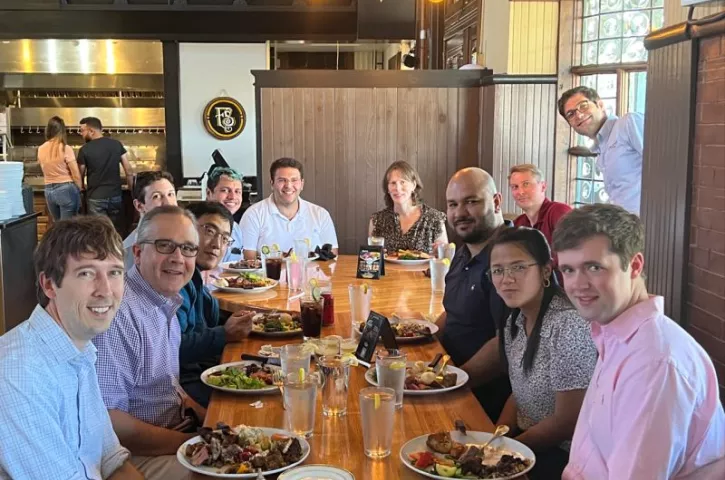 Group of People at Welcome Lunch For New Hire