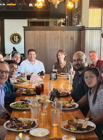 Group of People at Welcome Lunch For New Hire