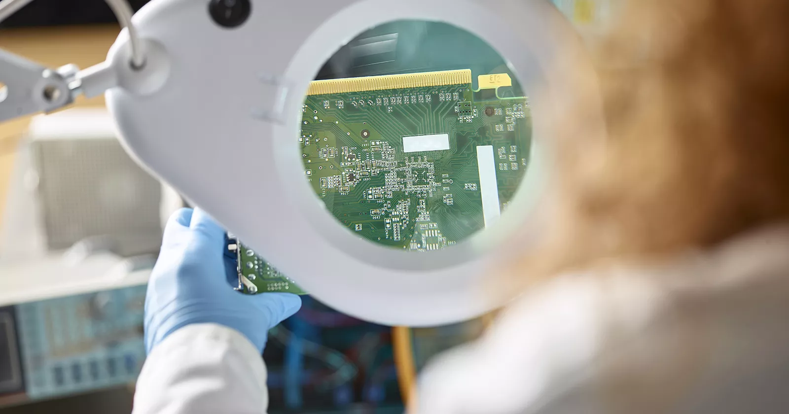 An Engineer evaluating electronic components. Exponent electrical engineers and computer scientists consult on  electronics.