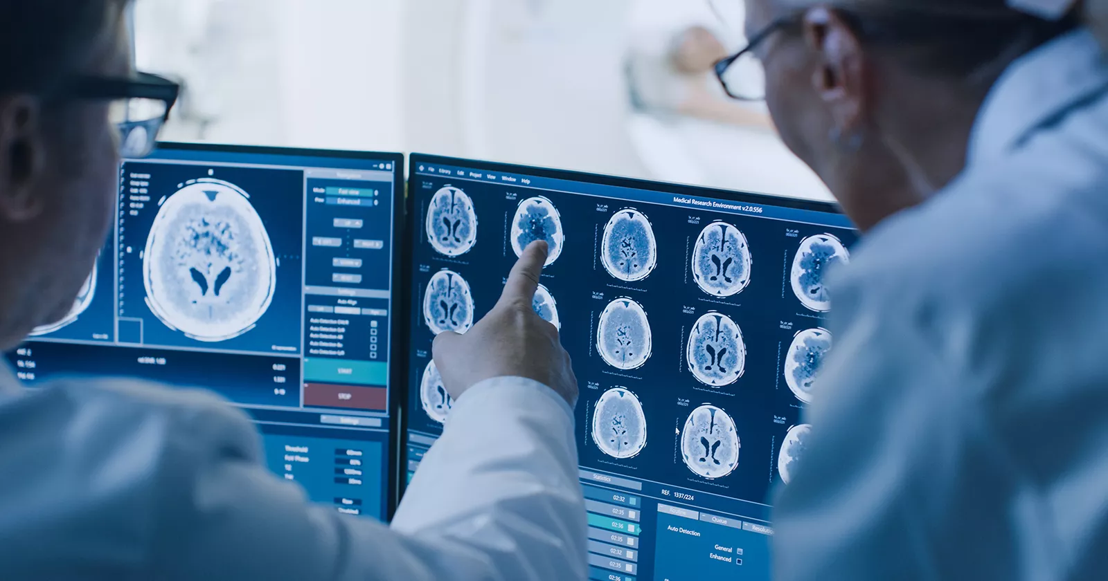 Medical professionals review cranial scans on a computer screen. Exponent data scientists help you capture the right data.