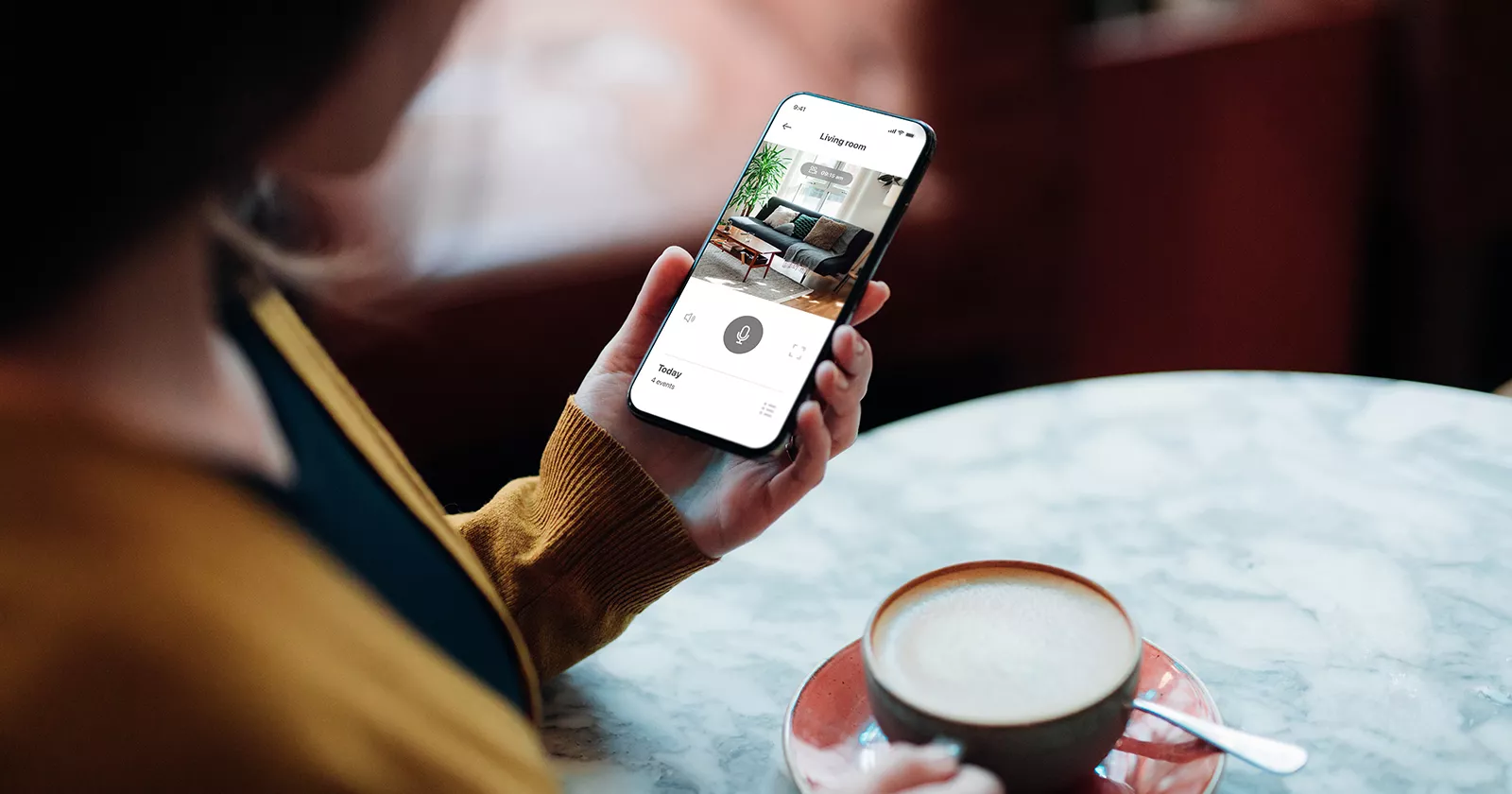 [EECS] Displays - person holds a phone with backlit screen while drinking coffee