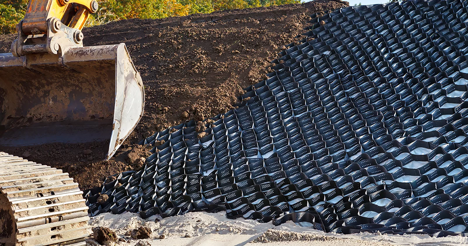 Polymer earth stabilization grid installed to prevent hillside erosion. Exponent civil engineering support for earth engineering.