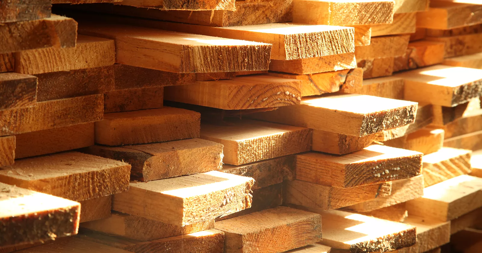 Stack of fresh milled lumber. Exponent construction engineers evaluate building materials.