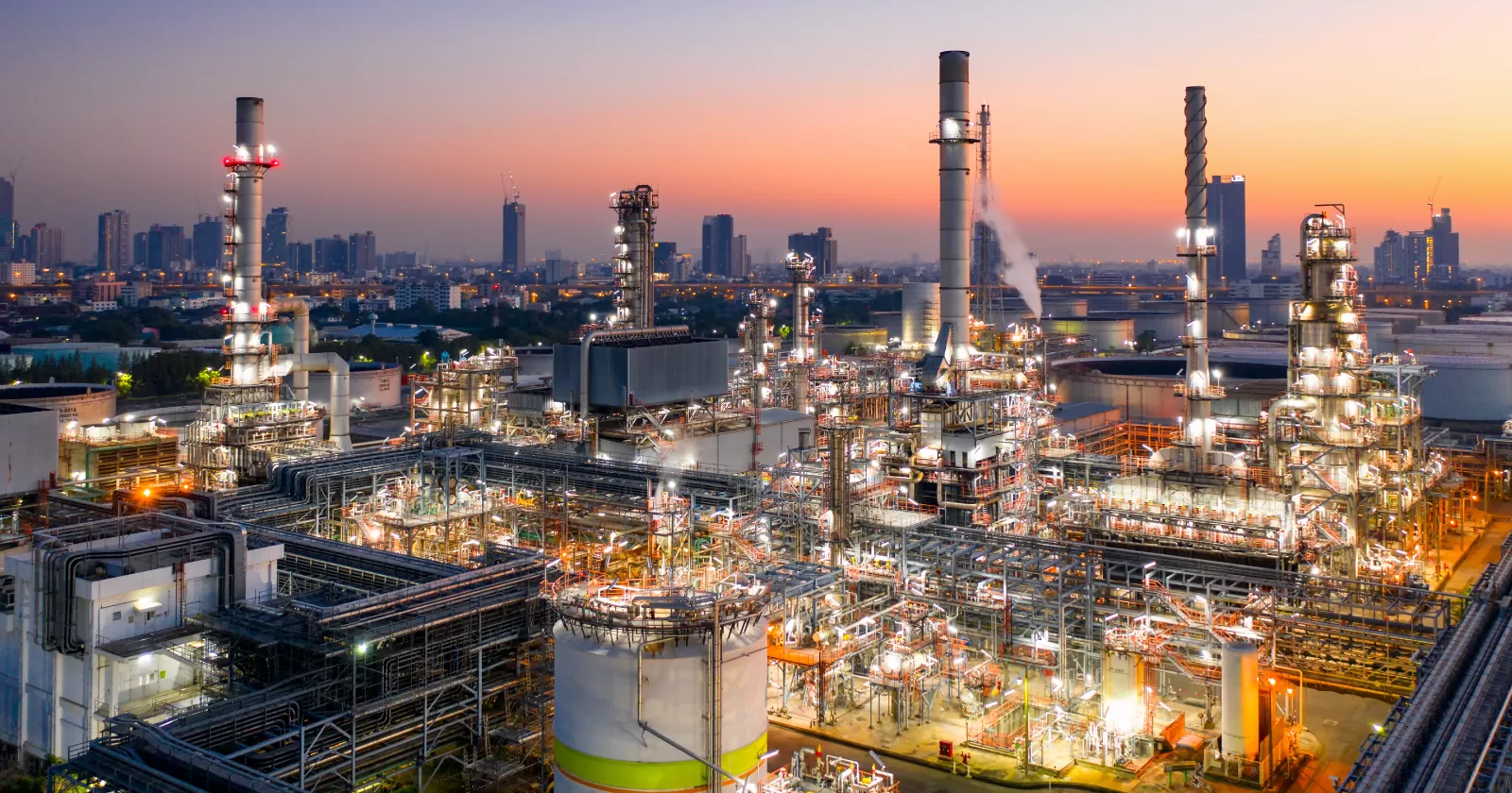 A view of an oil refinery lit up at night 