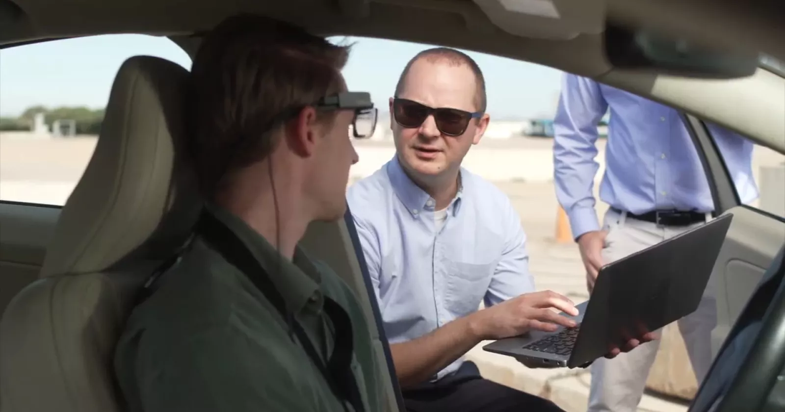 A man consults with an automotive tester