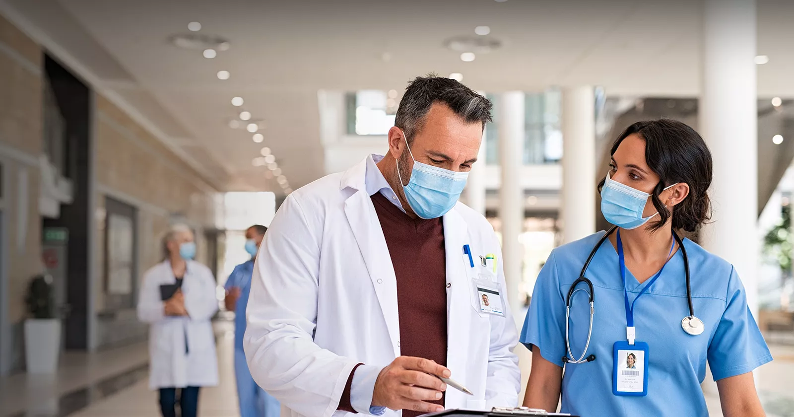 Masked hospital personnel