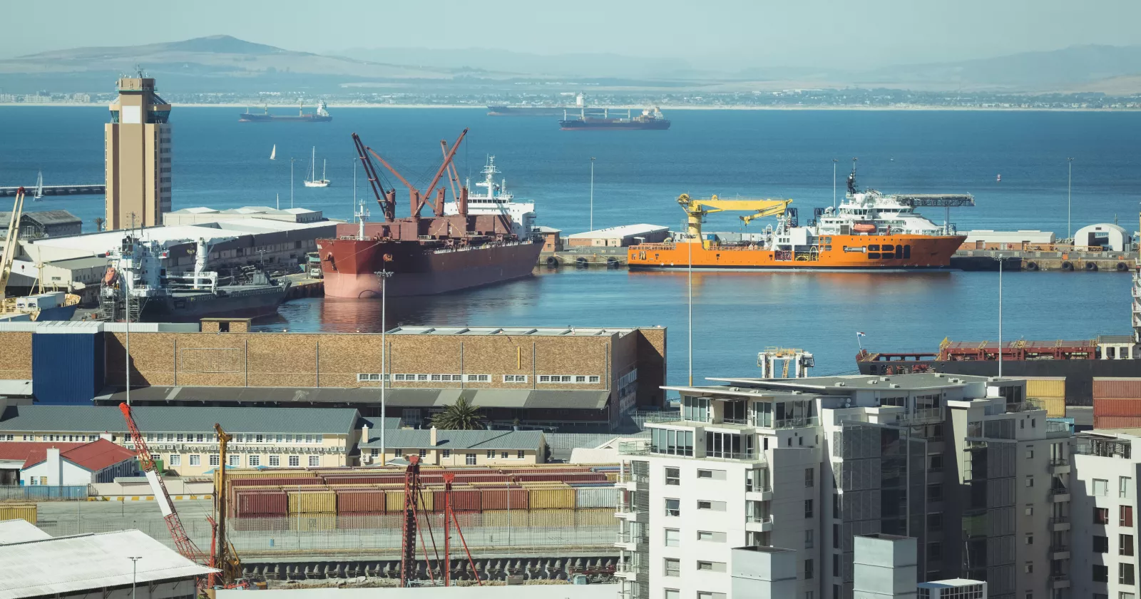 Ships in a harbor dock. Exponent technical consultants conduct environmental assessments and analyze contaminated sediment. 