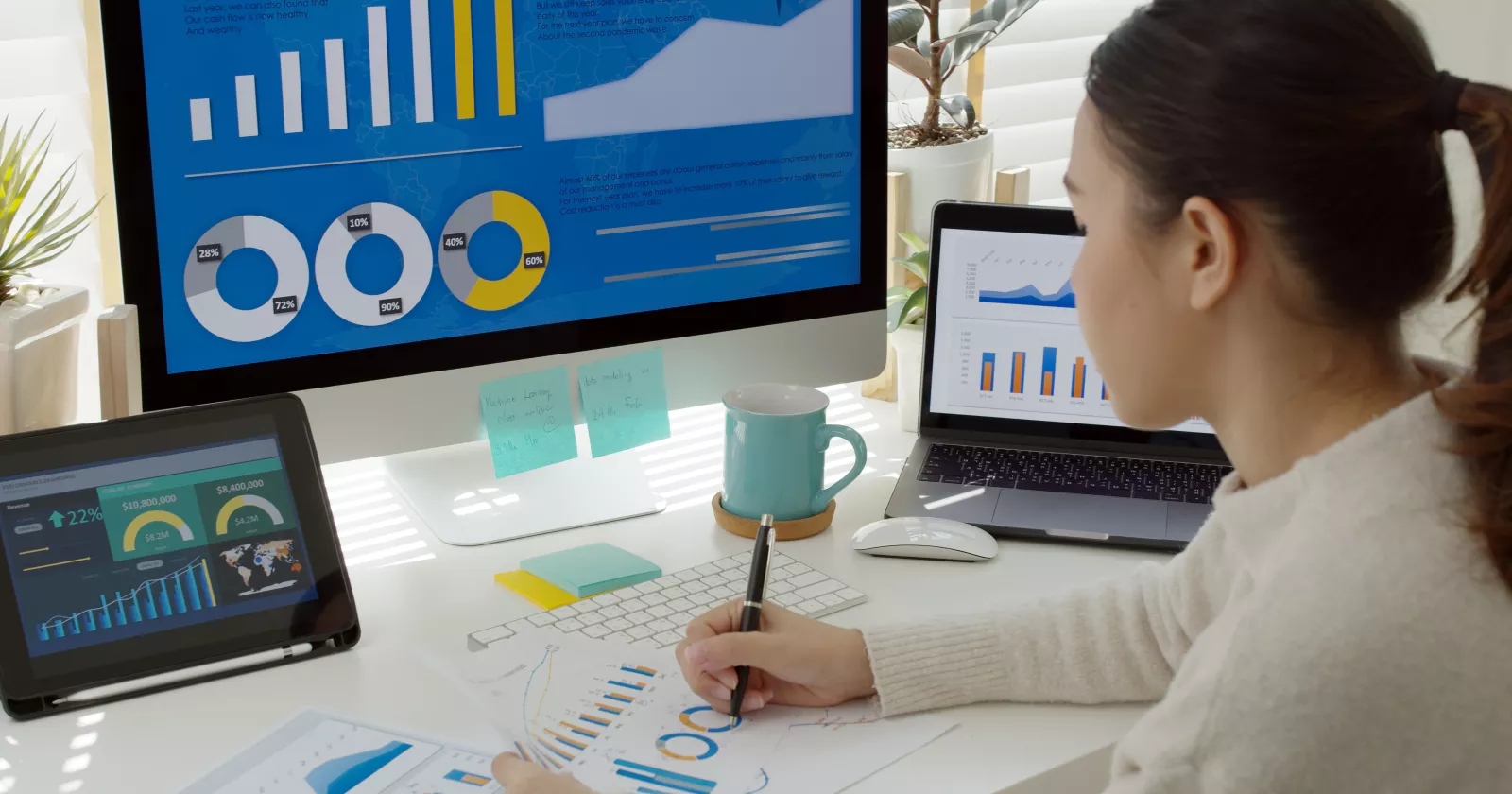 Woman working on spreadsheets at computer