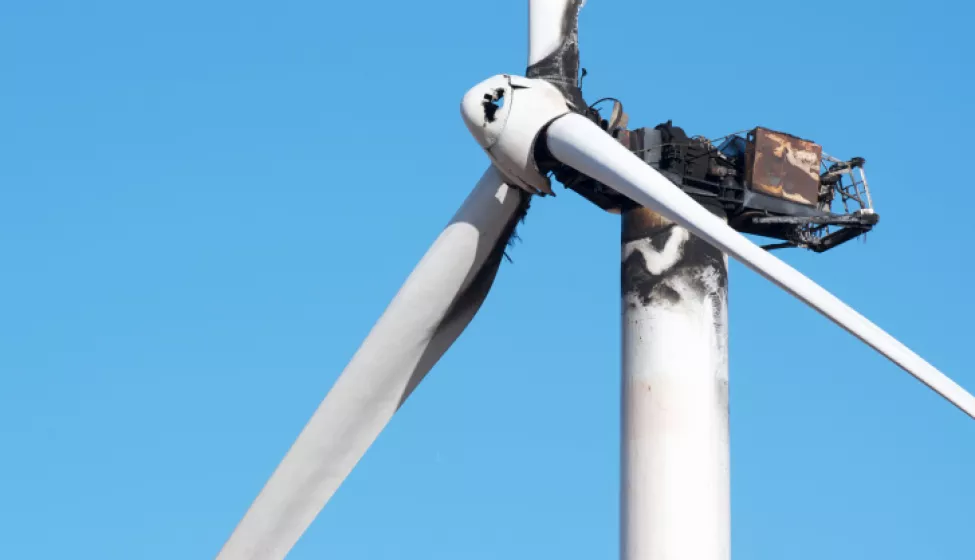 Damaged wind mill that has been burnt