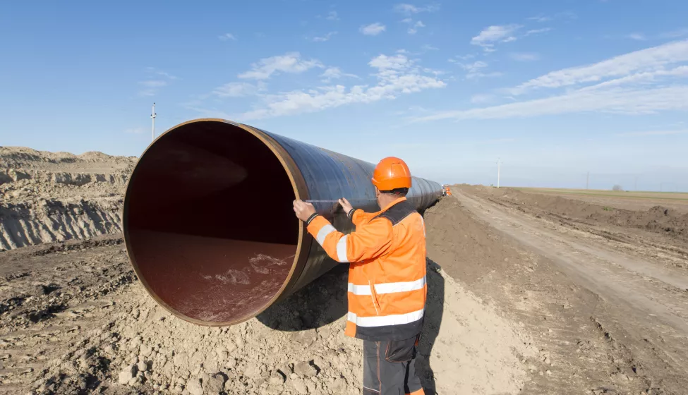 Workers at gas pipeline construction site.