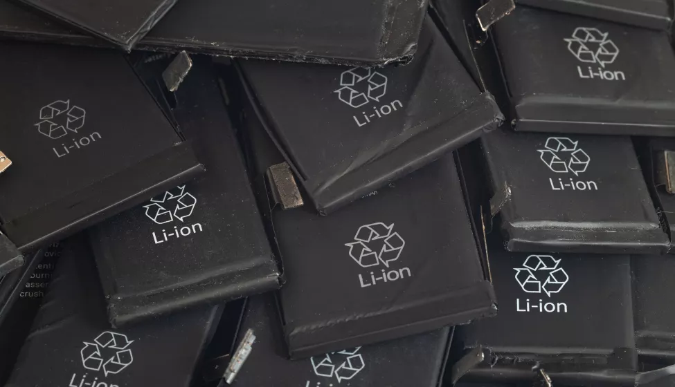 Close up of old used lithium polymer batteries of mobile phones preparation for recycling.