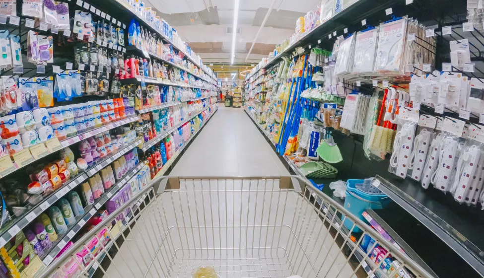 shopping cart in supermarket aisle