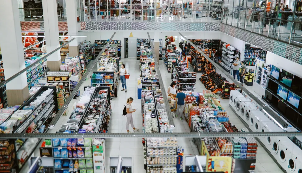 Overhead image of people buying in the large supermarket.
