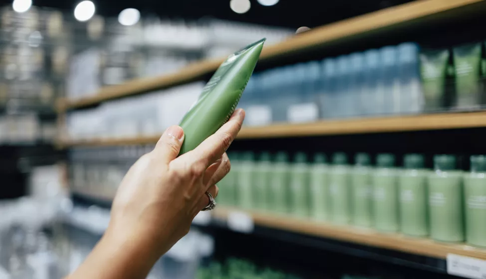 A Close Up View Of A Hand Holding A Beauty Product 