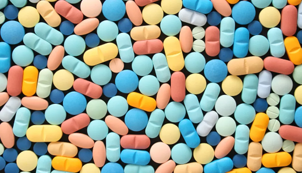 various colorful pills spread across a flat surface