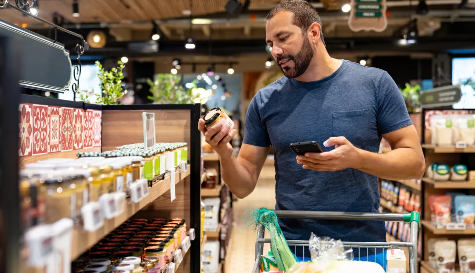 Healthy eating man shopping for organic products at the supermarket