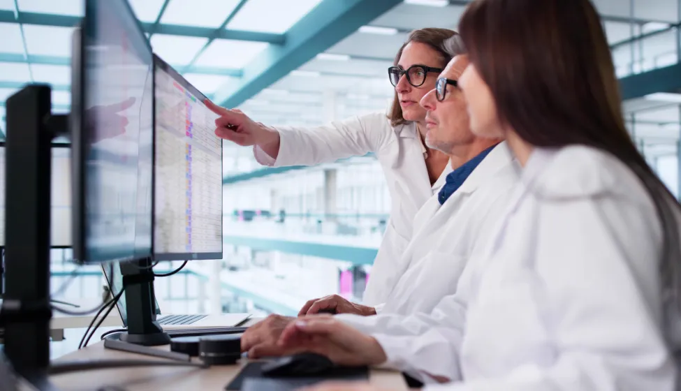 Busy Healthcare Team Using Medical Billing Coding Software In Hospital.