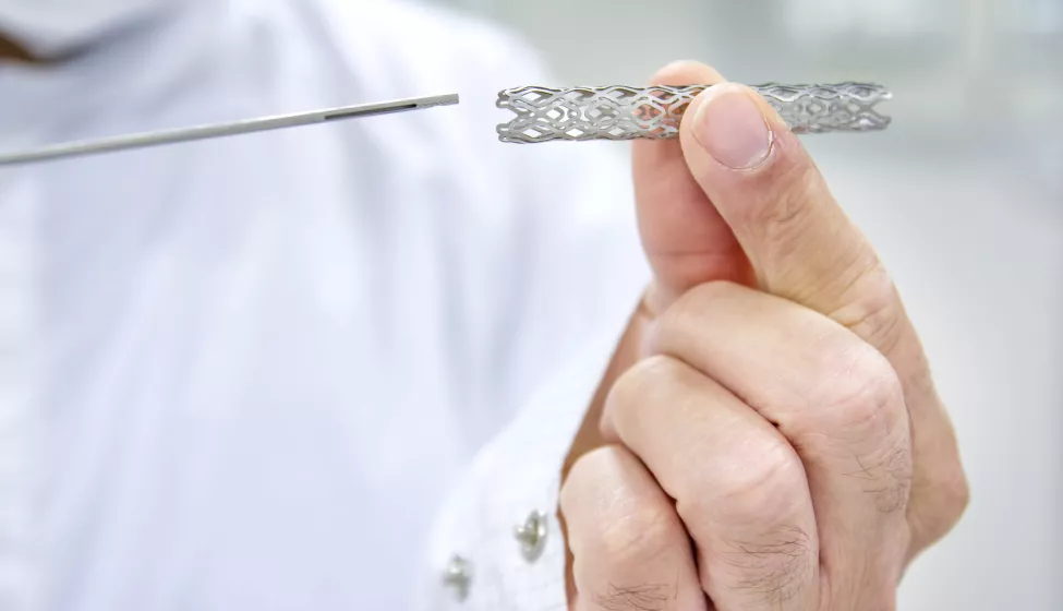 Man holds heart stent 