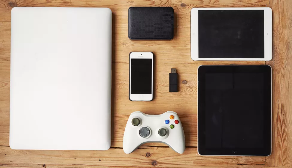 High angle shot of wireless technology on a wooden table