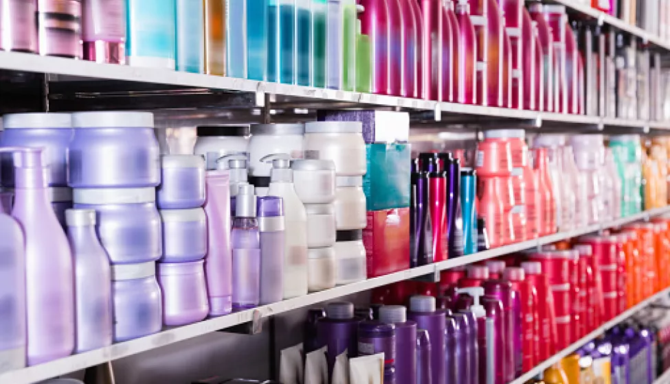 shelves with conditioners and mousses for hair in the store