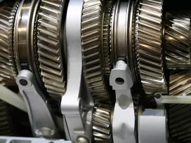 Artistic photo of mechanical gears. Exponent provides mechanical engineering support for disputes and claims.