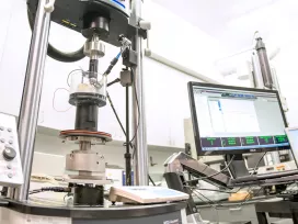 Scientific laboratory with testing machines and computers. Exponent's biomedical engineering laboratory.