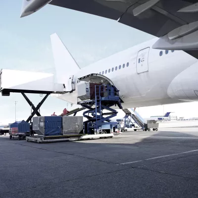 Passenger Plane being loaded with cargo